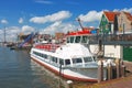 Tourist boat in the port of Volendam. Royalty Free Stock Photo