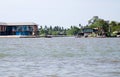 A tourist boat on the river in Amphawa District has a famous floating market and cultural attraction in Ratchaburi province Royalty Free Stock Photo