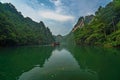 Tourist boat sailing among karst landscape on Baofeng Lake
