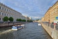 A tourist boat sails along the embankment of the river Moika in Royalty Free Stock Photo