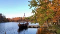 The Tourist Boat in the Style of a Viking Ship on the River Perse. Royalty Free Stock Photo