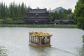 A tourist boat traveling to wang renkan hall