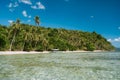 Tourist boat at tropical secluded sandy beach with coconut palm trees in El Nido, Palawan, Philippines Royalty Free Stock Photo