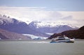 Tourist boat with Upsala Glacier in the background in the Argentino Lake, Argentina