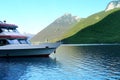 tourist boat on the water romantic lake, concept of sea voyage, a cruise on yacht, boat, tourist boat, green mountains rises above Royalty Free Stock Photo