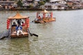 Tourist boating on traditional decorative boat in the scenic lake of Ban Rak Thai, a beautiful village within Mae Hong