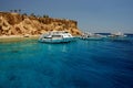 Tourist boats anchored by the island, Sharm El Sheikh, Sinai Peninsula, Red Sea, Egypt. Royalty Free Stock Photo