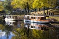 tourist boats Autumn park in the center of Riga, Latvia Canal that flows through Bastion park autumn