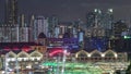 Tourist boats docking at Clarke Quay habour aerial night timelapse. Royalty Free Stock Photo