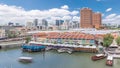 Tourist boats docking at Clarke Quay habour aerial timelapse. Royalty Free Stock Photo