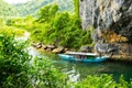 Tourist boats, the mouth of Phong Nha cave with underground river, Phong Nha-Ke Bang National Park, Vietnam Royalty Free Stock Photo