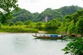 Tourist boats, the mouth of Phong Nha cave with underground river, Phong Nha-Ke Bang National Park, Vietnam