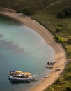 Tourist boats are parking at the empty beach. Royalty Free Stock Photo