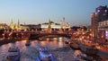 Tourist boats sail along the Moscow river at the Bolshoy Kamenny bridge in the evening. Moscow