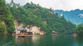 Tourist boats sailing among karst landscape on Baofeng Lake