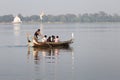 Tourist Boats Taungthaman Lake near Amarapura in Myanmar by the U Bein Bridge Royalty Free Stock Photo