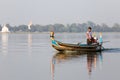 Tourist Boats Taungthaman Lake near Amarapura in Myanmar by the U Bein Bridge Royalty Free Stock Photo