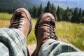 Tourist boots with mountain view on sunny day Royalty Free Stock Photo
