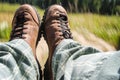 Tourist boots with mountain view on sunny day Royalty Free Stock Photo