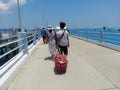 A tourist boy with his mother heading towards cruise at neil jetty of havelock