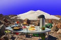 Tourist breakfast. High mountain summit camp
