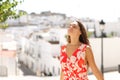 Tourist breaths fresh air in a white town on vacation Royalty Free Stock Photo