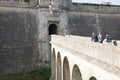 Tourist in bridge stone Blaye Citadel town France