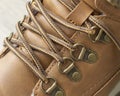 Tourist brown hiking boot with laces closeup