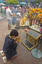 Tourist buddhist paying respect on Ratchaprasong Erawan shrine