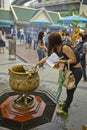 Tourist buddhist paying respect on Ratchaprasong Erawan shrine