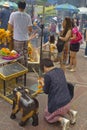 Tourist buddhist paying respect on Ratchaprasong Erawan shrine