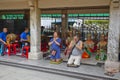 Tourist buddhist praying on Ratchaprasong Erawan shrine