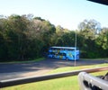 Tourist bus at Iguazu Falls with tourists going to visit the National Park of the Falls. Brazil