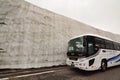 Tourist bus at snow corridor. Murodo. Tateyama Kurobe alpine route. Japan Royalty Free Stock Photo