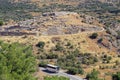 A tourist bus transports tourists to visit the archaeological site of Mycenae Royalty Free Stock Photo