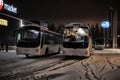 Tourist buses in a parking lot in the winter