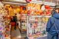 A tourist is buying some traditional masks from souvenir shop in Asakusa temple in Tokyo, Japan February 7, 2020 Royalty Free Stock Photo