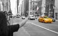 Tourist Call A Yellow Cab In Manhattan With Typical Gesture
