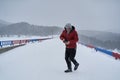 Tourist with camera in the blizzard Royalty Free Stock Photo