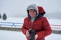 Tourist with camera in the blizzard Royalty Free Stock Photo