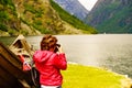 Tourist with camera near old viking boat, Norway Royalty Free Stock Photo