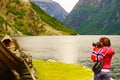 Tourist with camera near old viking boat, Norway Royalty Free Stock Photo