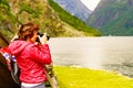 Tourist with camera near old viking boat, Norway Royalty Free Stock Photo