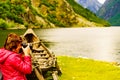 Tourist with camera near old viking boat, Norway Royalty Free Stock Photo