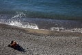 Tourist in Camogli`s beach in the fishing village of Camogli, Gulf of Paradise, Portofino National Park, Genova, Liguria, Italy