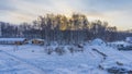 Tourist camp in winter. Wooden houses are standing in the snow. Royalty Free Stock Photo