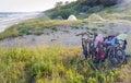 Tourist camping and bicycles on the seashore, cyclists tourists on the beach