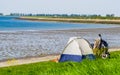 Tourist camping in a tent at the beach of tholen, touristic location in zeeland, the netherlands