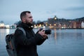 Tourist with camrea against Tyskebryggen in Bergen, Norway