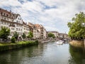 A tourist cruise boat on a canal in the Petite France area od Strasbourg, France